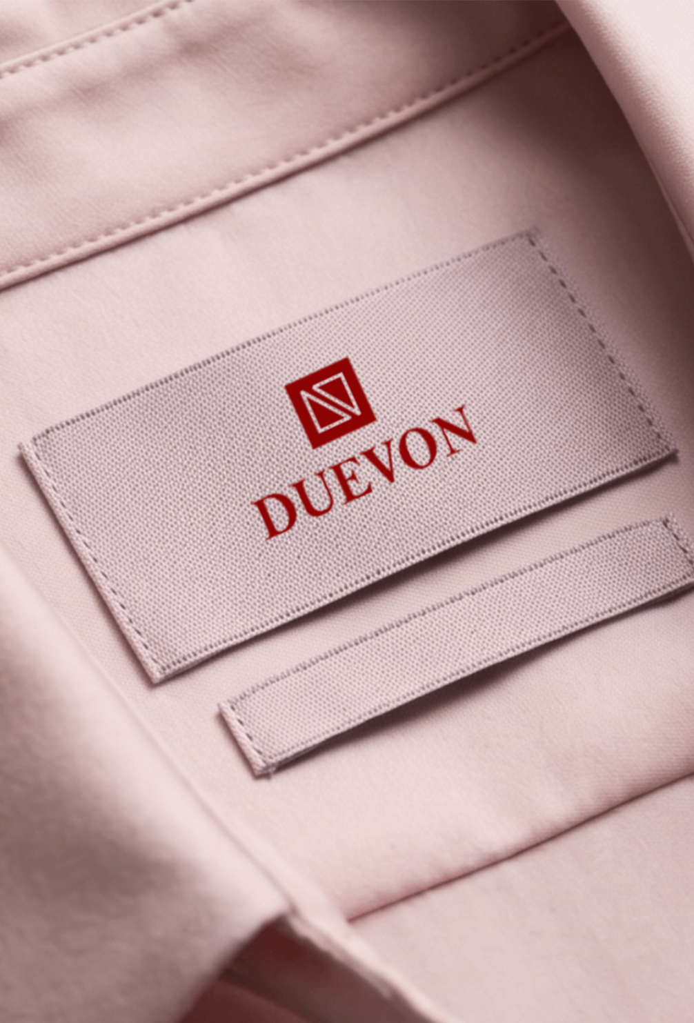 Duevon high-density woven satin neck label on blush garment